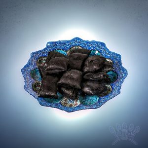 Licorice nuggets in a decorative blue bowl, showcasing Sepidan Osareh Jonoob's premium quality herbal product.