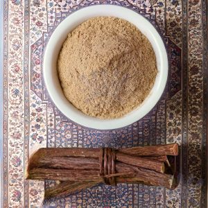 Licorice root powder displayed with dried licorice sticks, highlighting the natural and versatile products of Sepidan Osareh Jonoob.