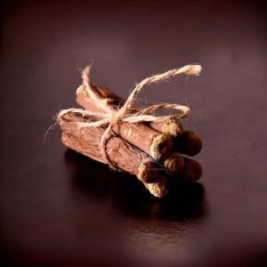 Bundle of licorice roots tied with twine, representing the natural and authentic products from Sepidan Osareh Jonoob."